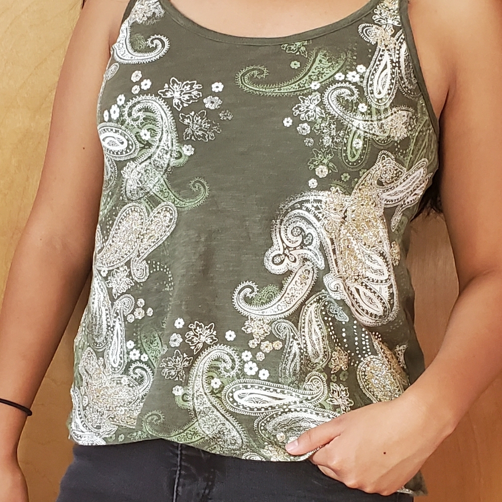 A green tang top, with gold and silver designs